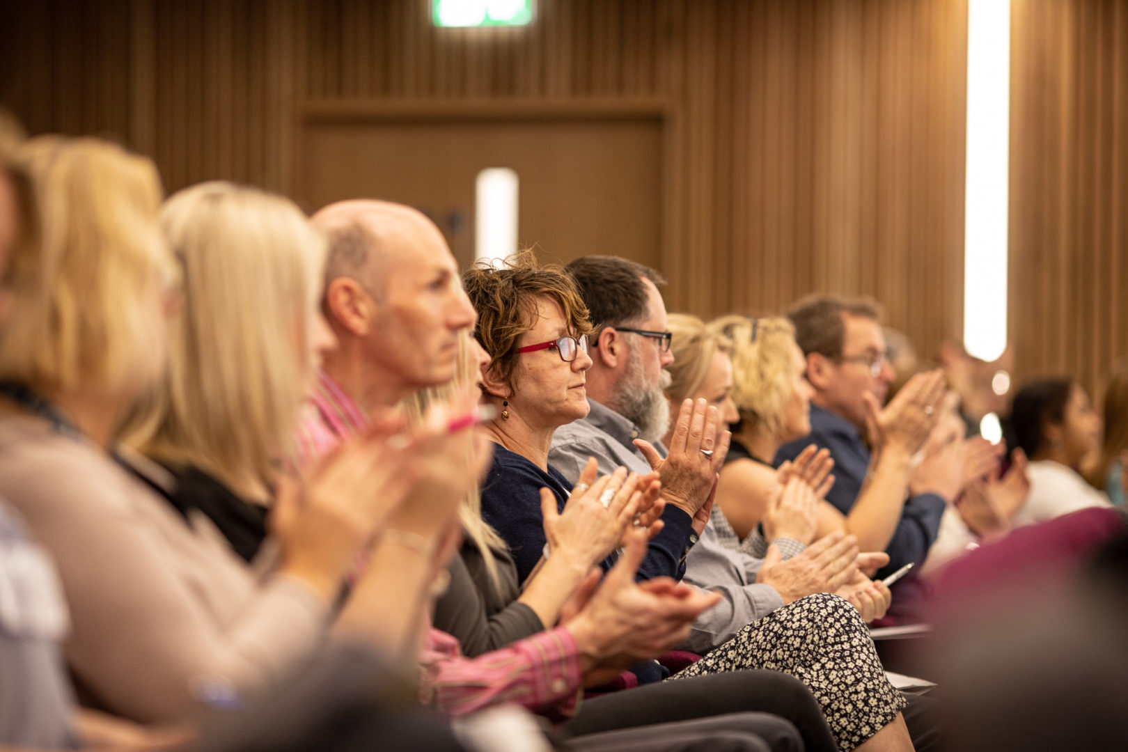 Crowd applauding in the Nexus atrium