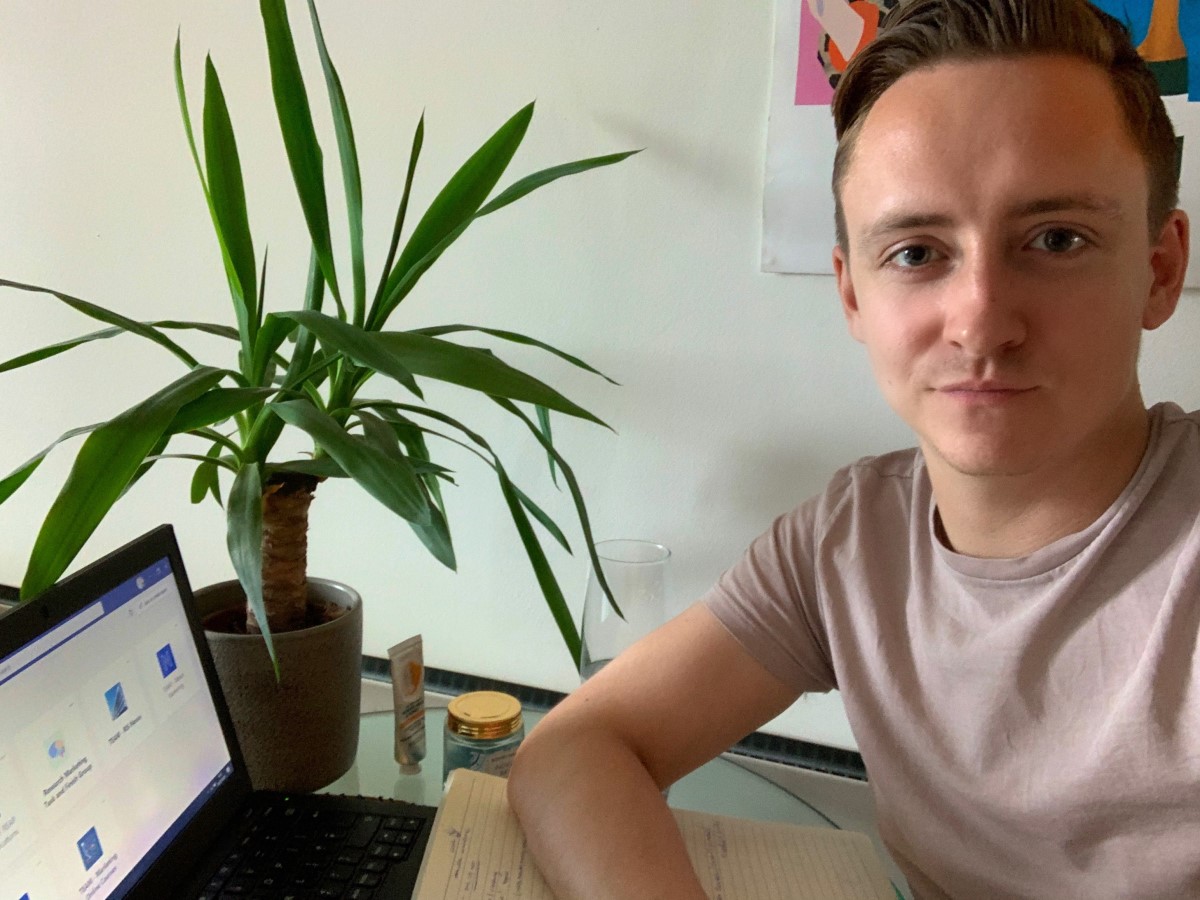 Photo of Alan Gallacher, Nexus Network & Events Manager sat at his home office and smiling to camera