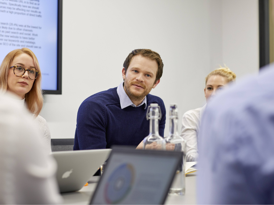 A man listening intently in a workshop session.