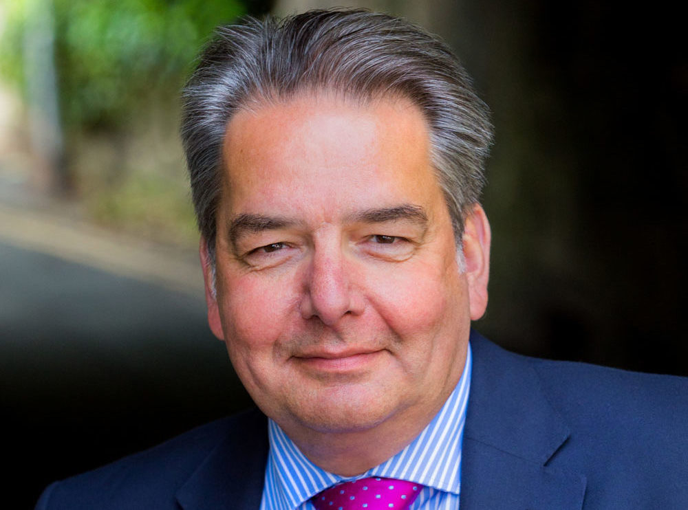 Head and shoulders shot of Steve Bennett, Founder and MD of the Business of Science Conference. Steve is stood outside and is smiling to camera