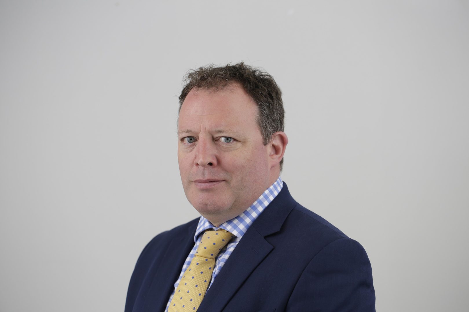 Head and shoulders shot of Mark Goldstone, smiling to camera