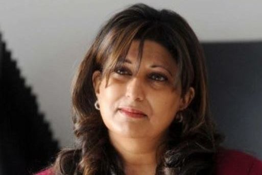 Head and shoulders shot of Sharon Jandu, Founder of the Yorkshire Asian Business Association (YABA) and Project Director of Northern Asian Power (NAP) looking into distance