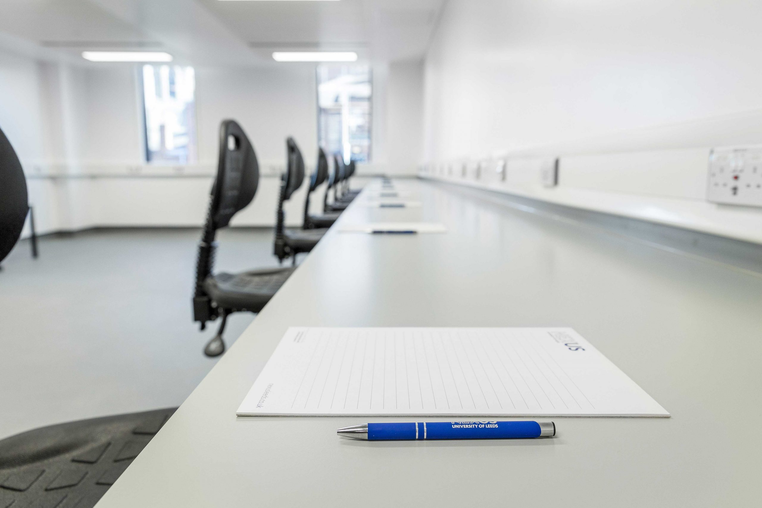 A photo of a lab bench in Nexus with a pen and paper on it