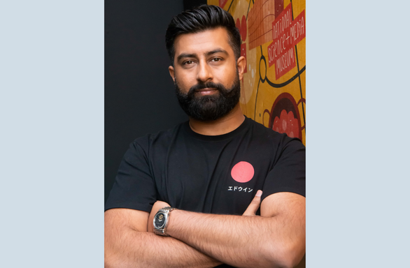 Head and shoulders shot of Kamran Rashid, Chief Executive of Impact Hub Bradford. Facing camera.