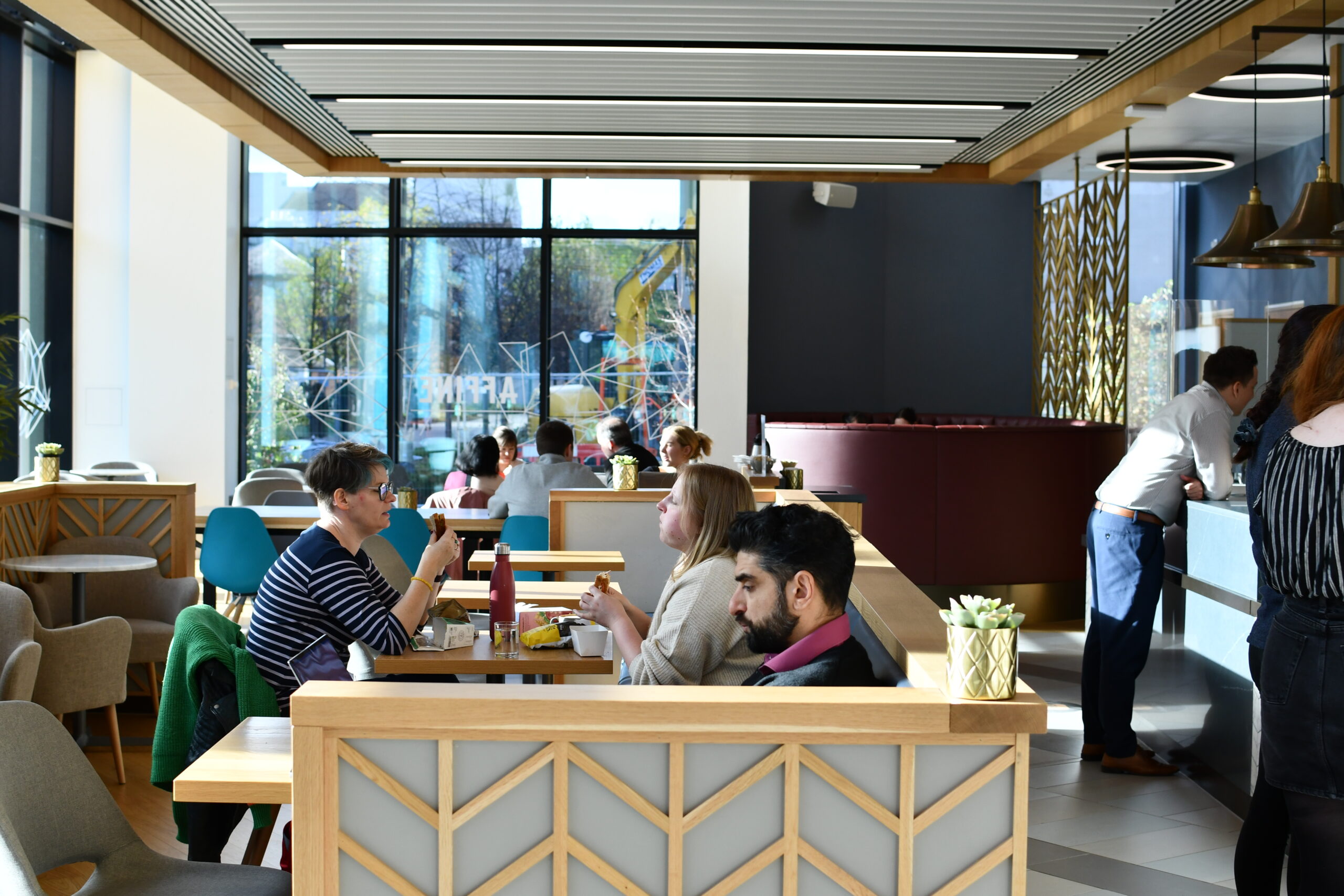 People sitting eating in the Nexus cafe