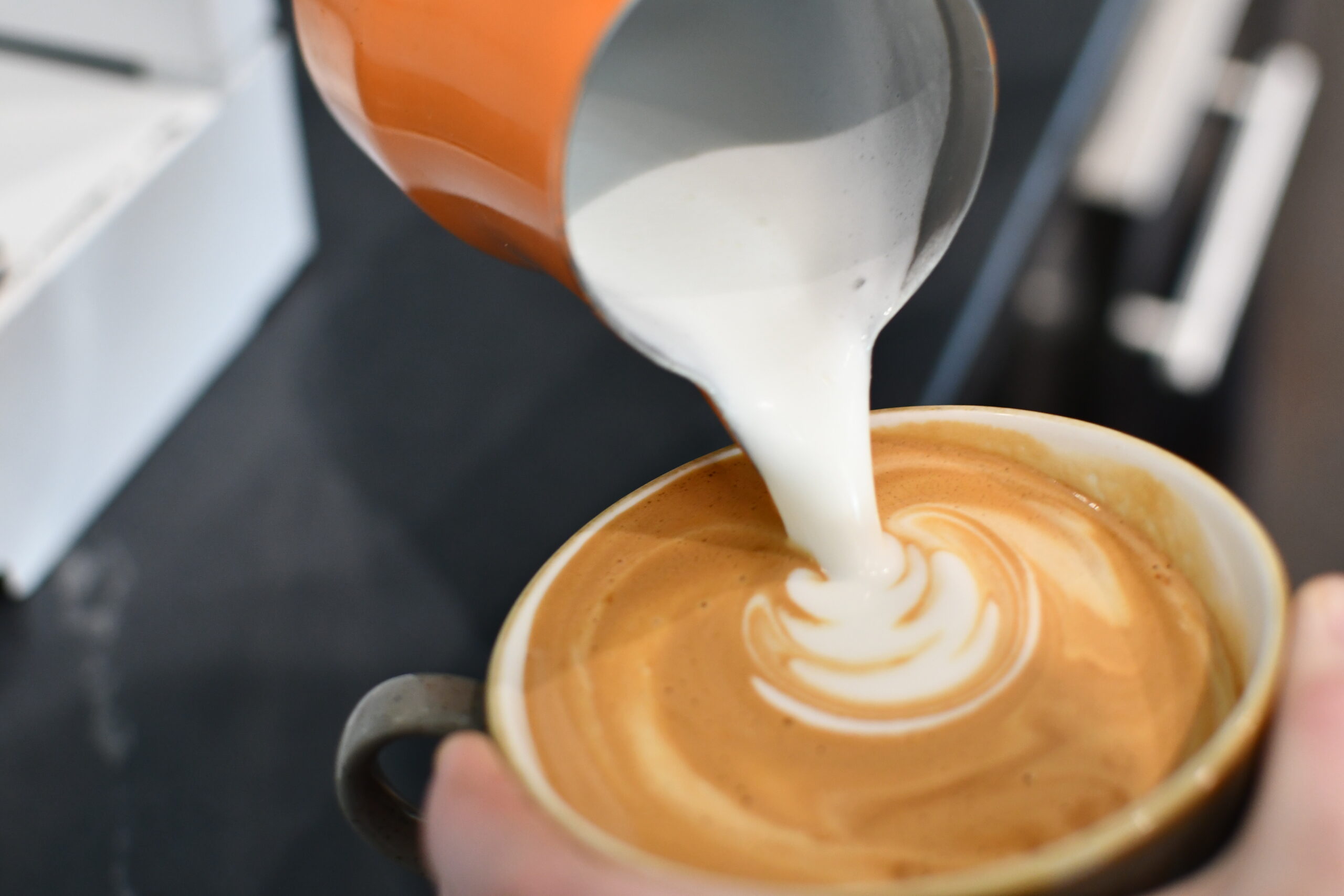 A coffee being poured in the Nexus cafe