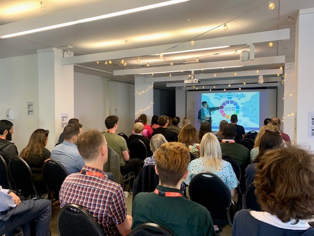 Audience listening to a speaker at Beyond Breakfast 2.