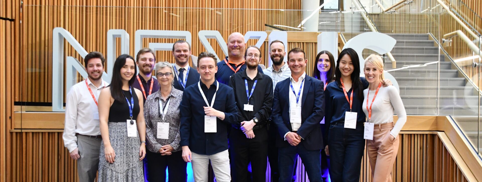 Photograph of the Nexus team smiling to camera.